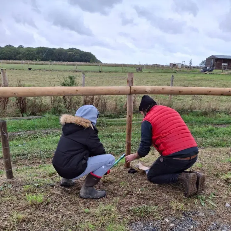 Child engaged in purposeful outdoor activity at Maypole Farm