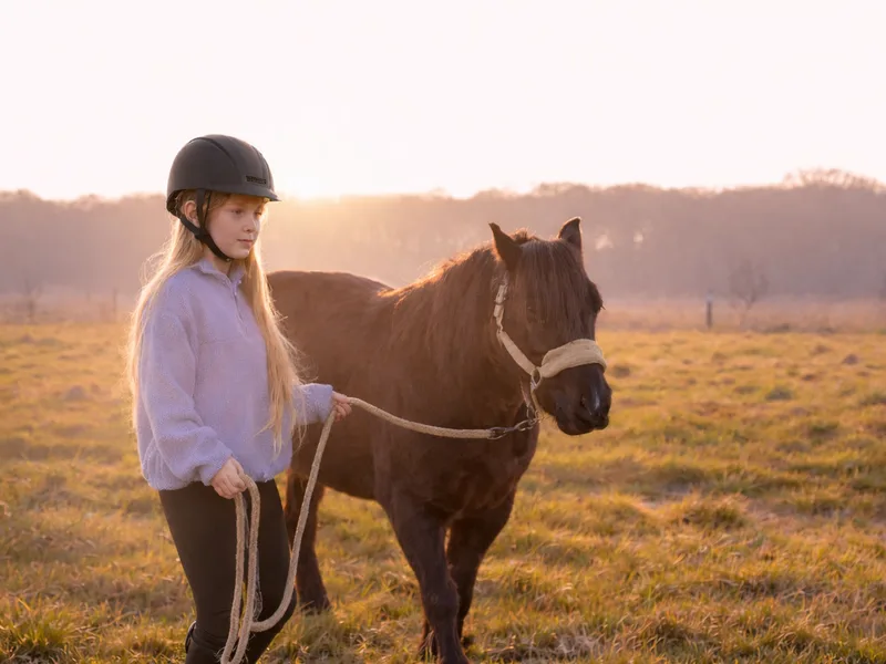 Young person in a calm outdoor learning setting at Maypole Farm